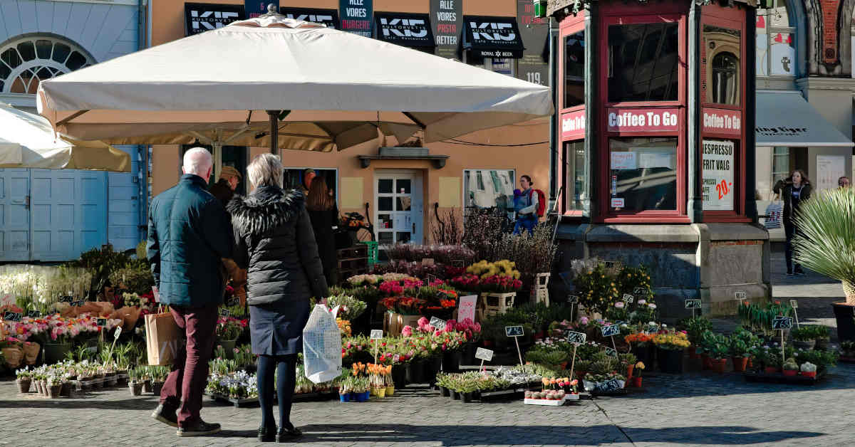 Old couple in front of a flower shop