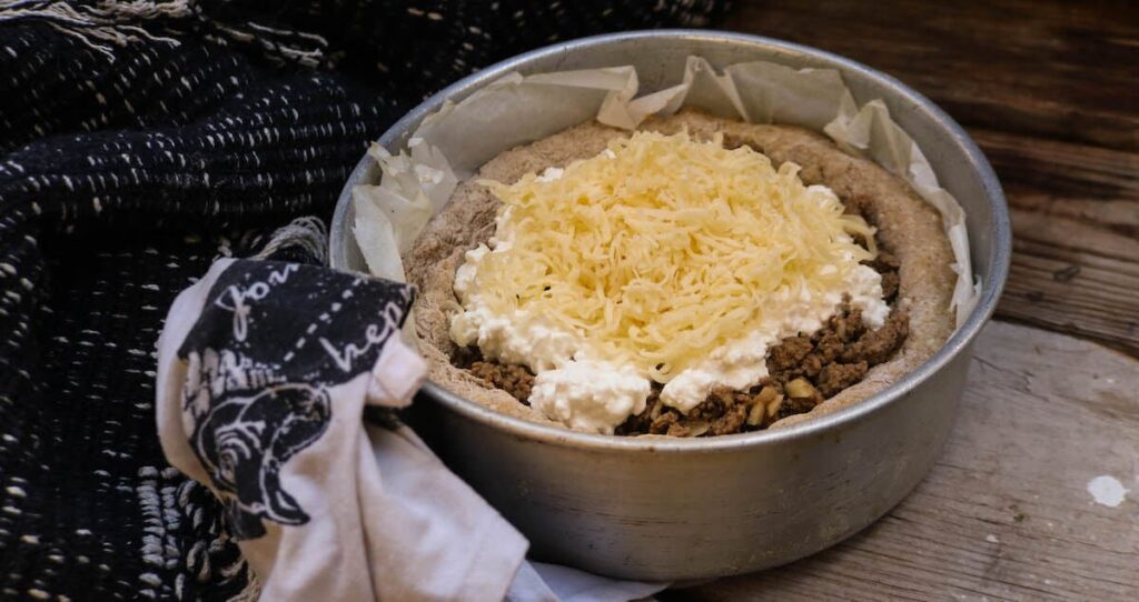 step 5 - filling up the keto pie with filling and topping